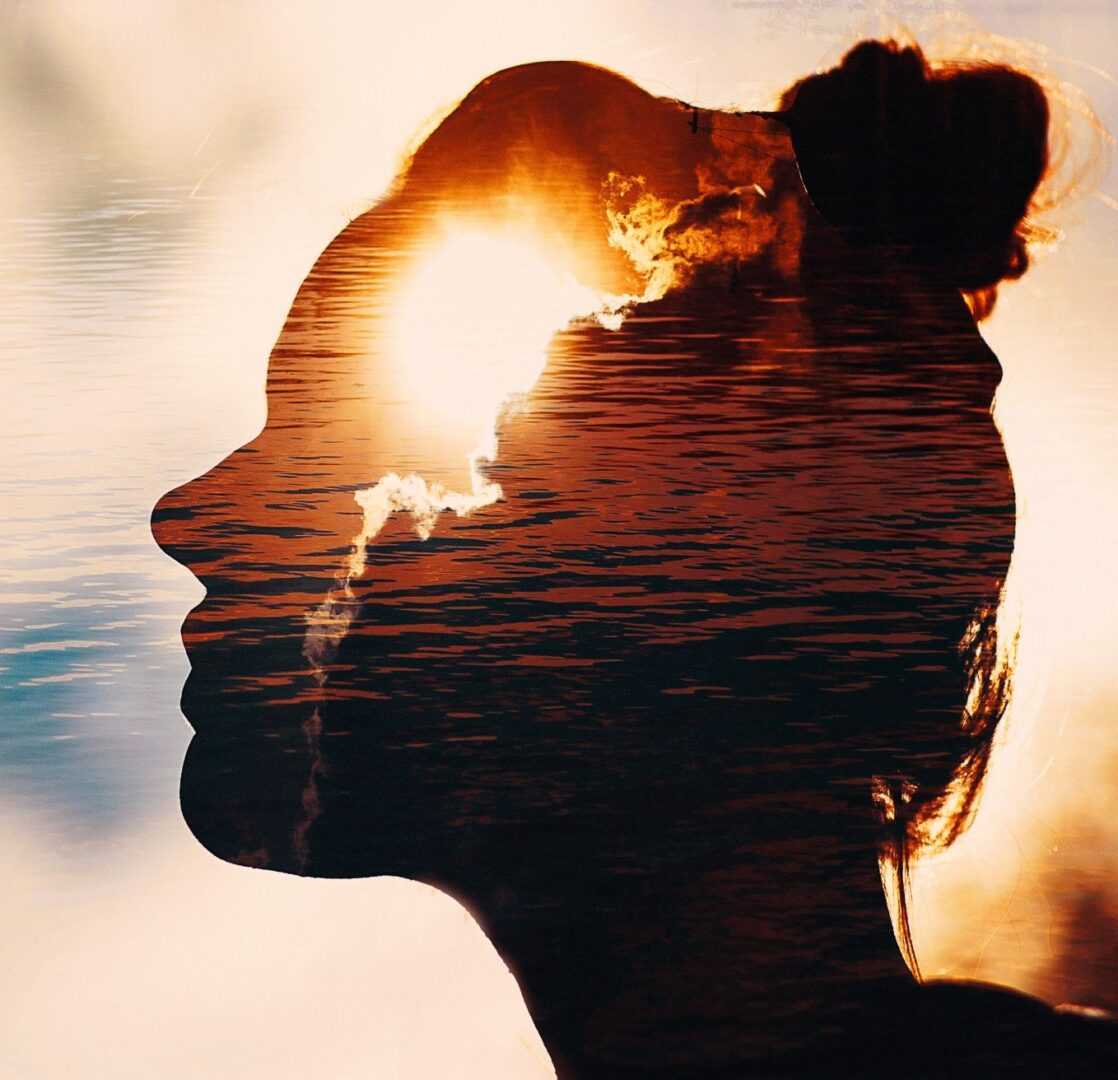 GettyImages-1197670670 A woman with her head turned to the side.